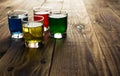 Blue yellow green red alcohol shot drinks Royalty Free Stock Photo