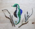 Sea glass, stones, shells and driftwood art project