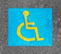 Handicapped parking sign paint on asphalt