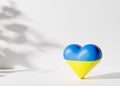 Blue and yellow heart shape, colors of Ukrainian flag. Russian Ukrainian conflict. Save Ukraine. Stop war, military Royalty Free Stock Photo