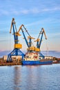 Blue and Yellow Industrial Cranes in the Harbor of Wismar. Germany