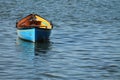 Blue yellow kayak canoe parked in harbor isolated Royalty Free Stock Photo