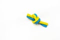 Blue-yellow knot with plasticine as a symbol of invincible Ukraine on a white background, War in Ukraine