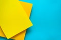 Blue and yellow pastel color papered background. Volume geometric flat lay. Top view. Copy space Royalty Free Stock Photo