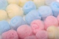 Blue, yellow and pink hygienic cotton balls in row Royalty Free Stock Photo