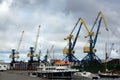 Blue and yellow port cargo cranes in the harbour