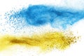 Blue and yellow powder explosion isolated Royalty Free Stock Photo