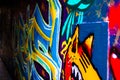 Blue, yellow, red and orange graffity in Werregarenstraat Graffiti Street in Ghent, Belgium, Europe. Colorful famous street in