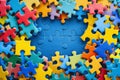 Blue, yellow, red pieces of puzzle frame on light blue puzzle background with copy space for text. World autism Royalty Free Stock Photo