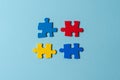 Blue, yellow, red pieces of puzzle on light blue background. World autism awareness day concept. Top view, copy space Royalty Free Stock Photo