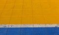 Blue and yellow rubber flooring on Futsal field background Royalty Free Stock Photo