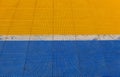 Blue and yellow rubber flooring on Futsal field background Royalty Free Stock Photo