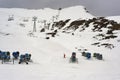 Snow canon at ski resort with mountains on background