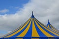 Blue and yellow striped circus big top tent Royalty Free Stock Photo