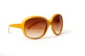 Blue and yellow sunglasses on a white background Royalty Free Stock Photo