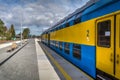 Blue and yellow train is ready to depart from platform on Hel peninsula station Royalty Free Stock Photo