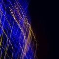 Blue and Yellow Twisted Light Trails Background