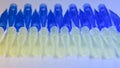 Blue and yellow universal laboratory pipet tips. Laboratory and science material concept