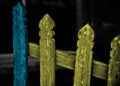 Blue and yellowish wooden objects of a protection wall