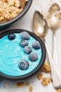 Blue yogurt with berries in the black bowl Royalty Free Stock Photo