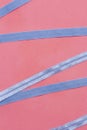 Blue zigzag ribbon on pink table