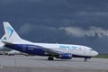 Blueair jet taxiing, dark sky