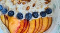 Blueberries and apricots with fresh oatmeal in plate