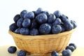 Blueberries in bamboo basket on white background Royalty Free Stock Photo