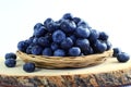 Blueberries in bamboo basket on white background Royalty Free Stock Photo