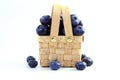 Blueberries in bamboo basket on white background Royalty Free Stock Photo