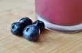 Blueberries Beneath a Blueberry Smoothie Royalty Free Stock Photo