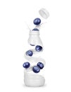 Blueberries with a bottle made from milk splashes