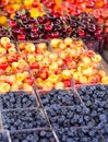 Blueberries and Cherries at an Outdoor Market