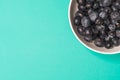 Blueberries fruit in bowl, Colorful back ground