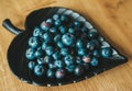 Blueberries heart plate on wooden table