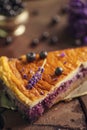 Blueberries and lavander cheesecake served on oven with berries and flowers, still life for patisserie, healthy cake Royalty Free Stock Photo