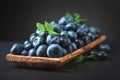 Blueberries with leaves in wooden dish Royalty Free Stock Photo