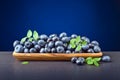 Blueberries in old wooden dish . Royalty Free Stock Photo