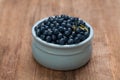 Blueberries on rustic rown wooden board background. Healthy eating Royalty Free Stock Photo