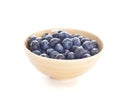 Blueberries spilling out of a bowl