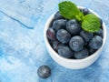 Blueberries in spoon on dark background