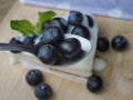 blueberries on spoon and Piece of blueberry cheesecake