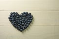 Blueberries summer berry on wooden table. Vitamin C, E, P, PP, B carotene flavonoids ascorbic acid. Organic fresh