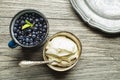 Blueberries with sweet cream served for dessert