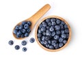 Blueberries in wood bowl and spoon  isolated on white background. Royalty Free Stock Photo