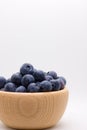 Blueberries in wooden bowl Royalty Free Stock Photo
