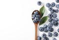 Blueberries and wooden spoon placed on a white background Royalty Free Stock Photo