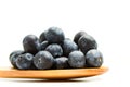 Blueberries on a wooden spoon on a white background Royalty Free Stock Photo
