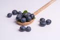 Blueberries on wooden spoon on white background Royalty Free Stock Photo