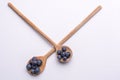 Blueberries on wooden spoon on white background Royalty Free Stock Photo